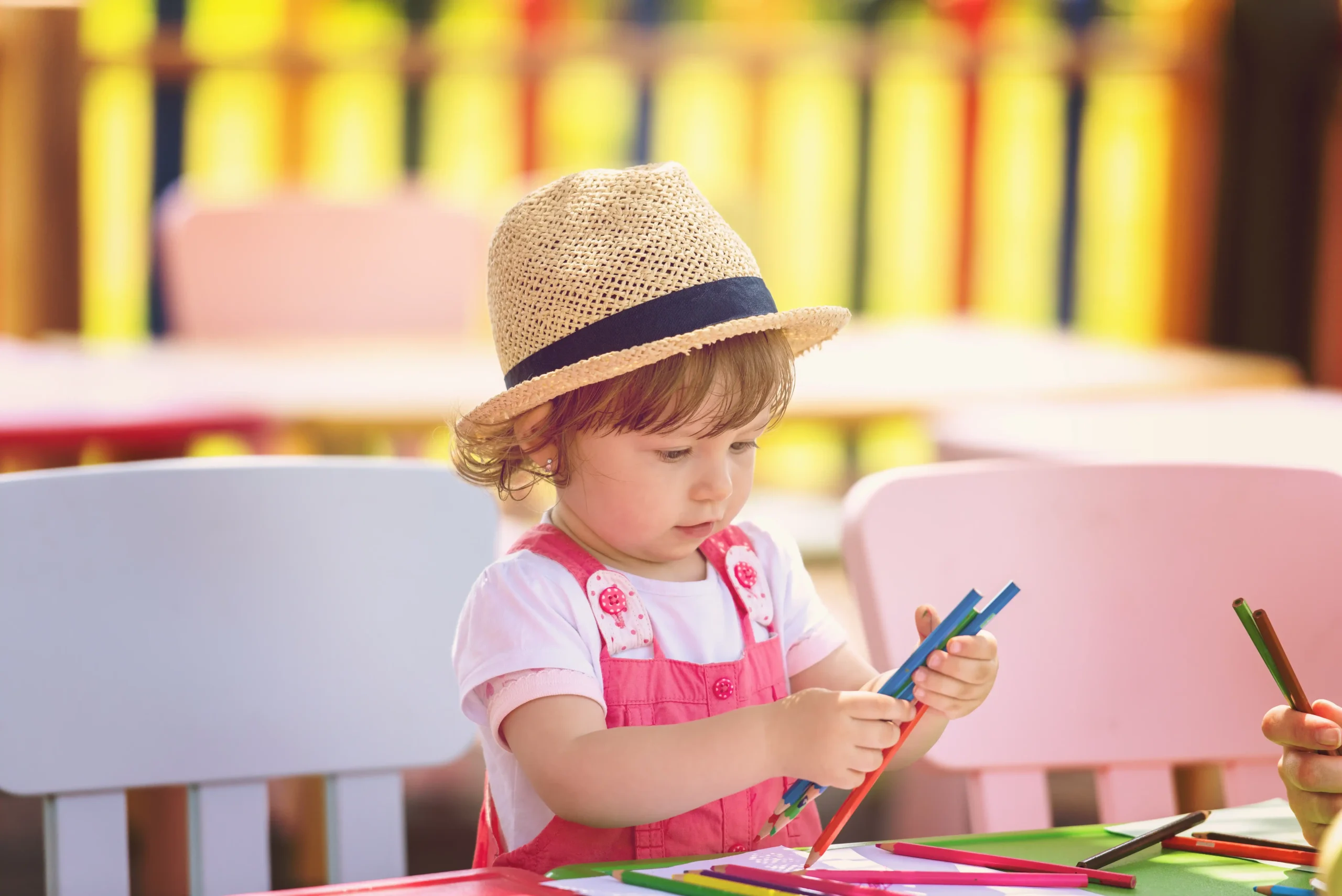 child-with-hat-drawing-with-colored-pencils-2026-03-17-19-44-46-utc