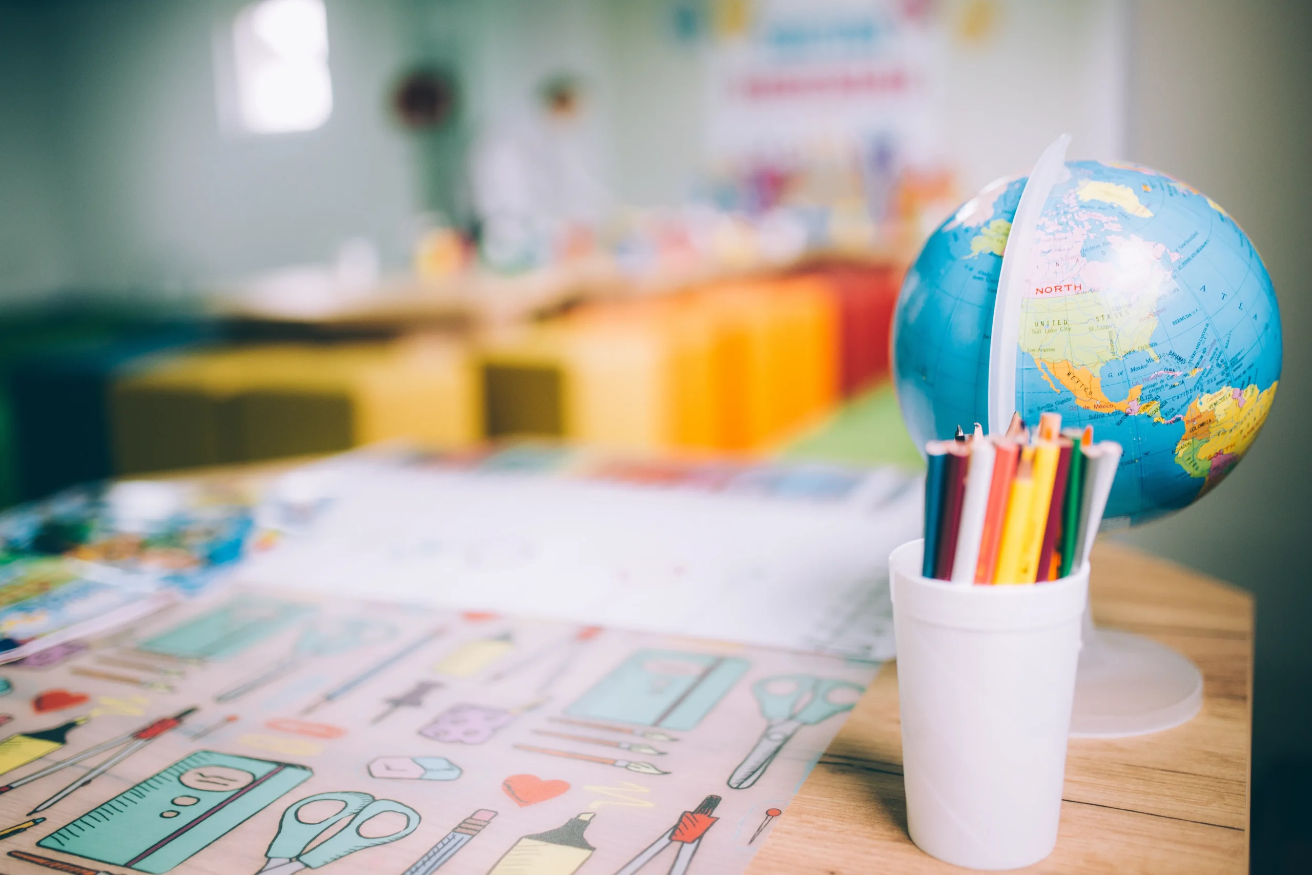 closeup-shot-of-colorful-pencils-in-a-cup-and-a-gl-2026-01-07-07-29-51-utc