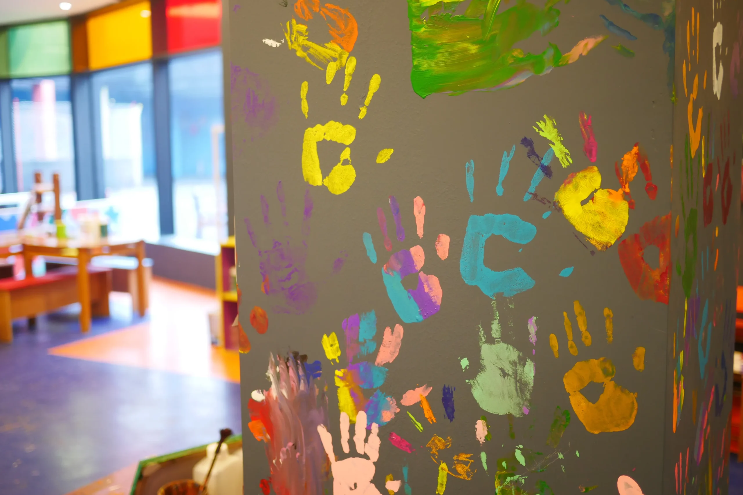 colorful-handprints-on-wall-in-a-playroom-2026-01-07-01-21-33-utc - Copia